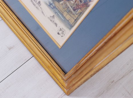 Zlatá fileta ladí jak s obrazem, tak i luxusním modelovým rámem a modrou paspartou